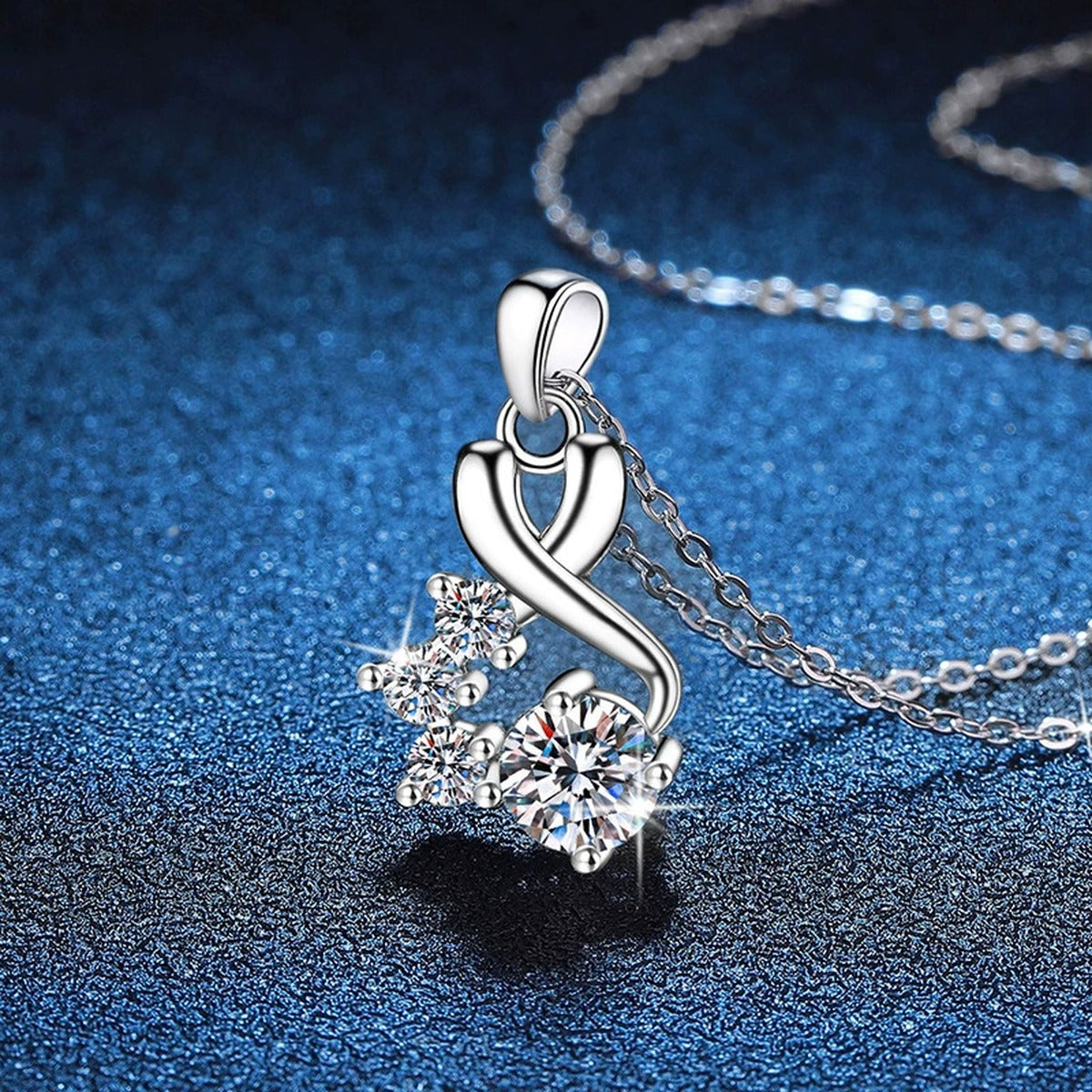 Twist Cluster Moissanite Pendant Necklace in Platinum-Plated S925 Sterling Silver blue background angled view