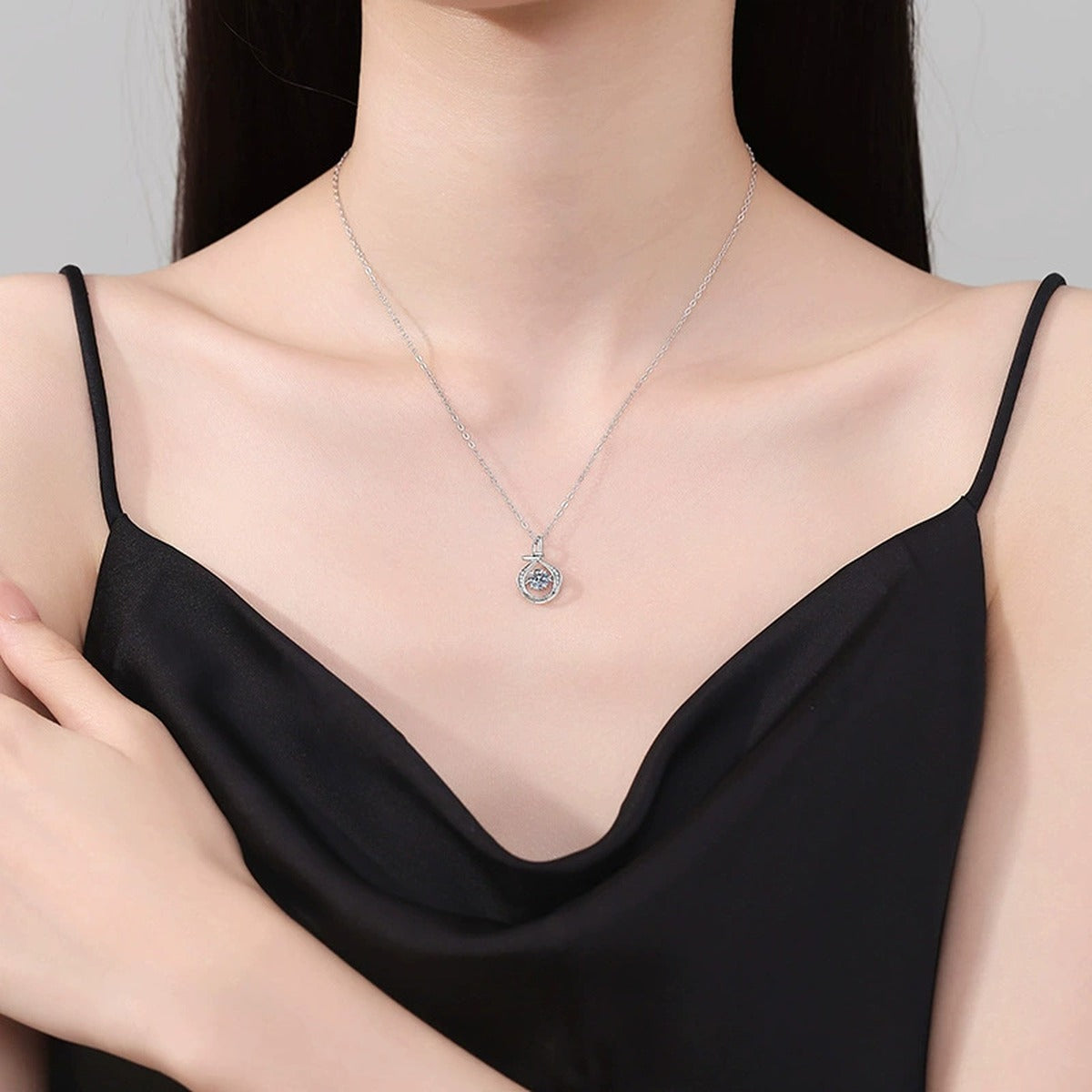 Teardrop Halo Moissanite Pendant Necklace in Platinum-Plated S925 Sterling Silver worn on neckline by model