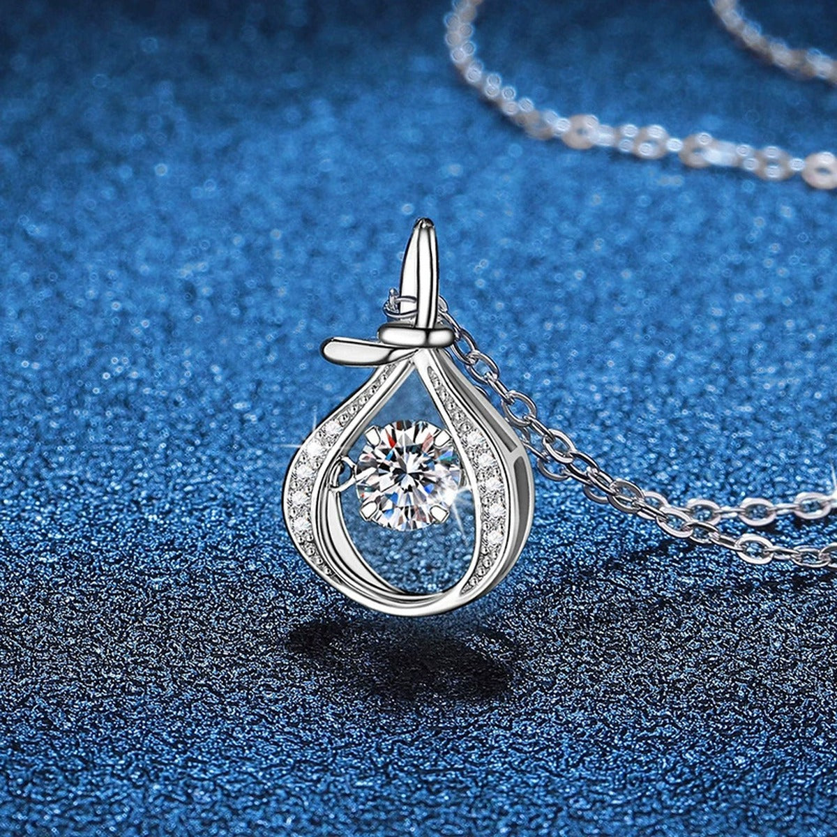 Teardrop Halo Moissanite Pendant Necklace in Platinum-Plated S925 Sterling Silver blue background product view