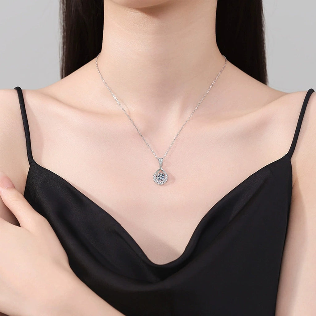 Teardrop Halo Moissanite Pendant Necklace in Platinum-Plated S925 Sterling Silver worn on neckline by model