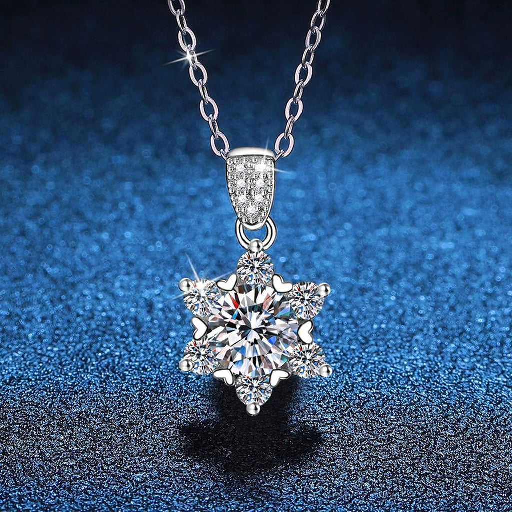 Floral Star Halo Moissanite Pendant Necklace in Platinum-Plated S925 Sterling Silver blue background angled view