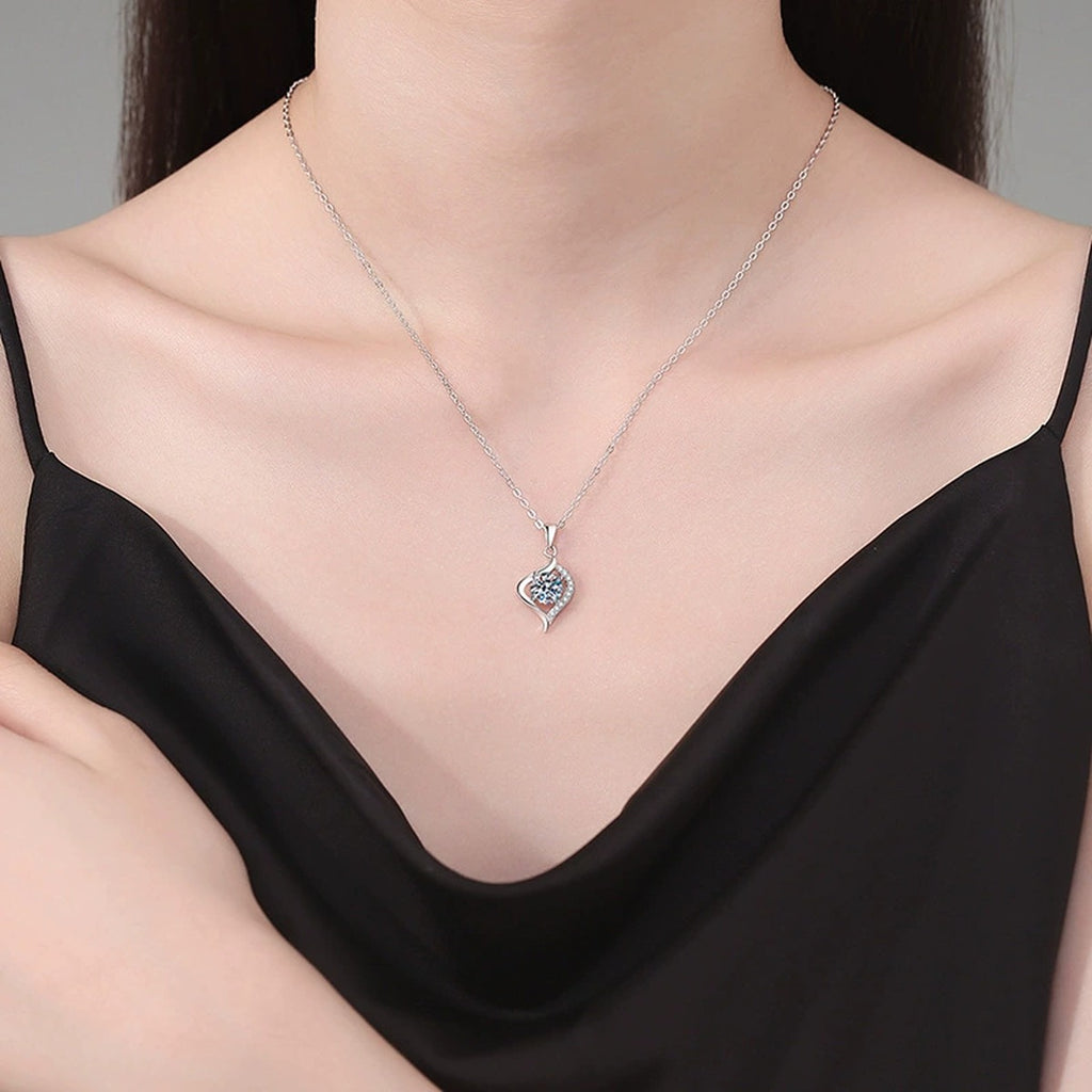 Twist Leaf Moissanite Pendant Necklace in Platinum-Plated S925 Sterling Silver worn on neckline by model