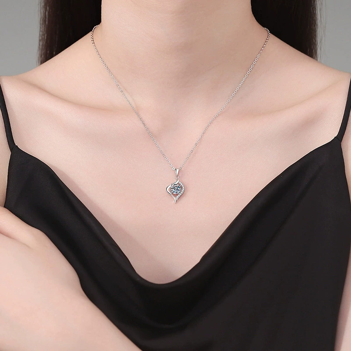 Twist Leaf Moissanite Pendant Necklace in Platinum-Plated S925 Sterling Silver worn on neckline by model