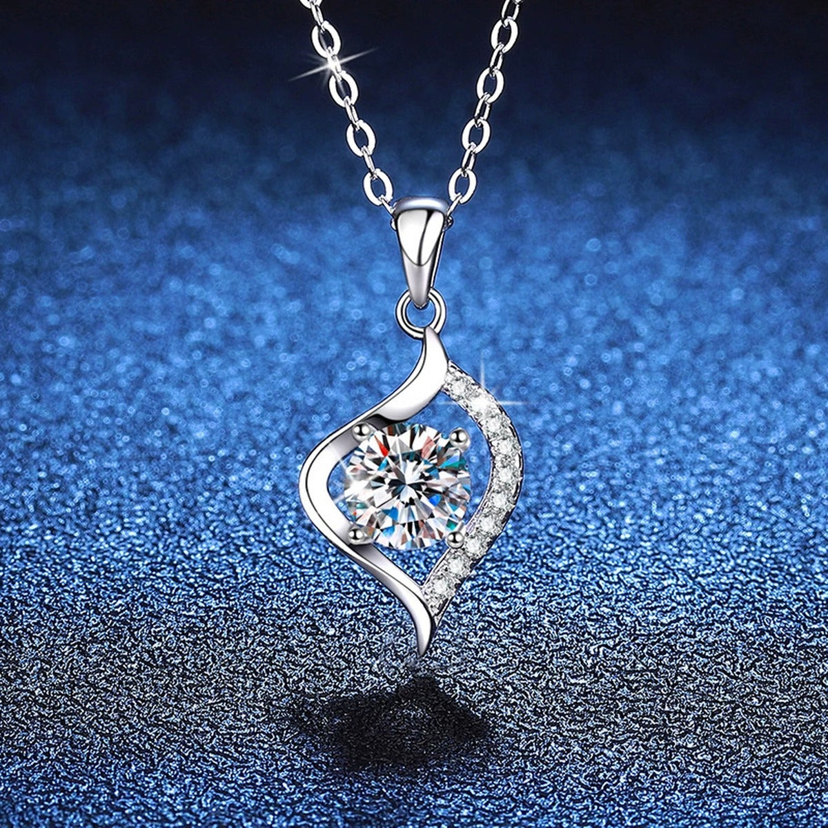 Twist Leaf Moissanite Pendant Necklace in Platinum-Plated S925 Sterling Silver blue background angled view