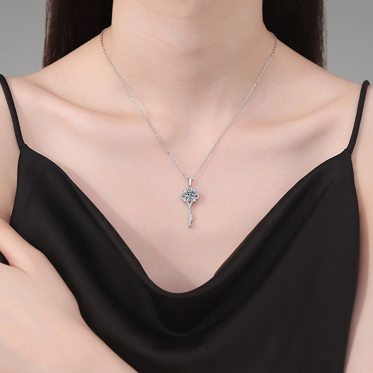 Cross Key Moissanite Pendant Necklace in Platinum-Plated S925 Sterling Silver worn on neckline by model