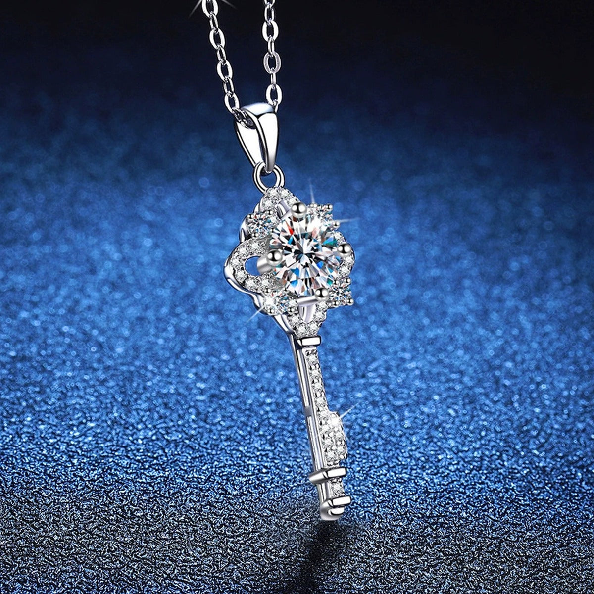 Cross Key Moissanite Pendant Necklace in Platinum-Plated S925 Sterling Silver blue background angled view
