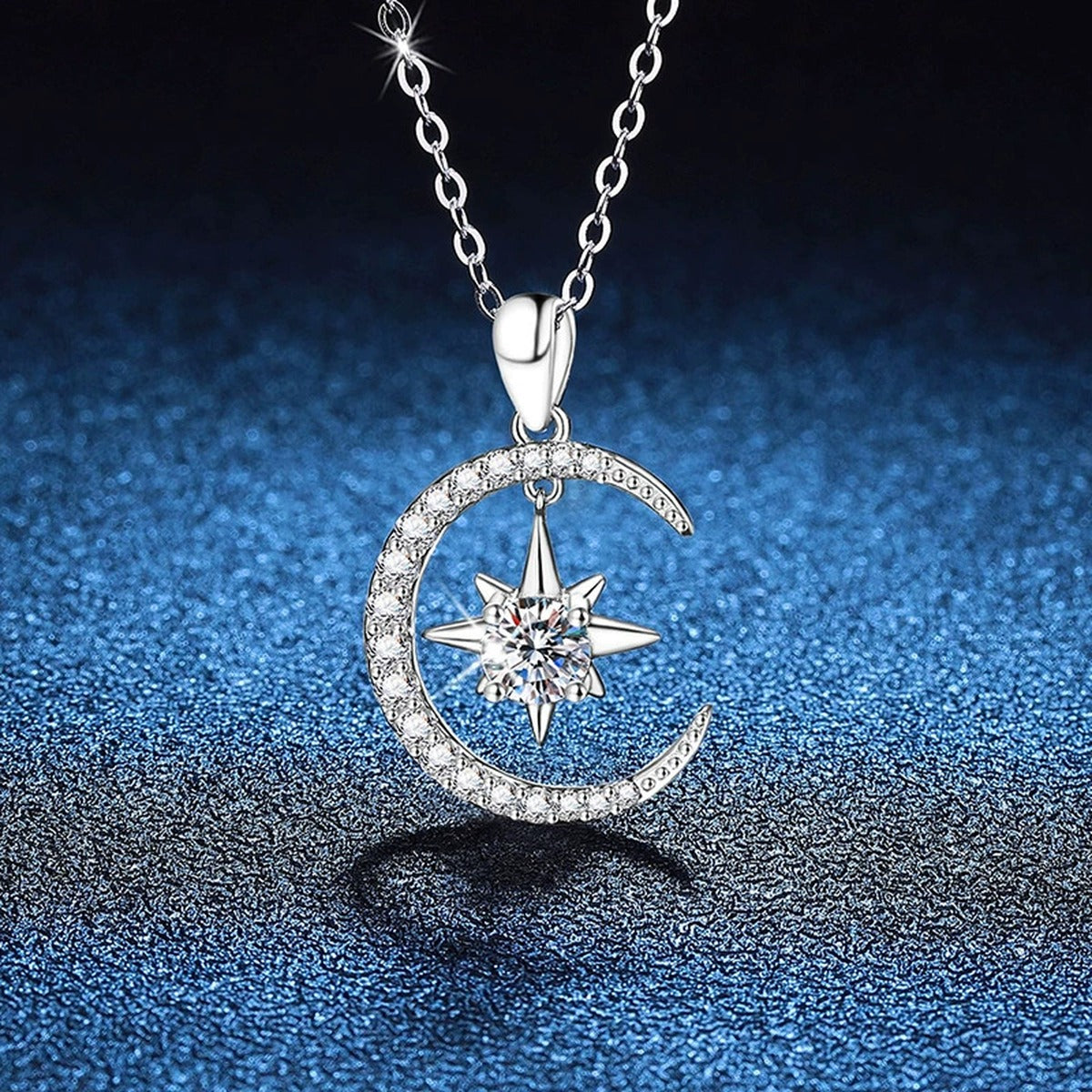Crescent Moon Star Moissanite Pendant Necklace in Platinum-Plated S925 Sterling Silver blue background angled view