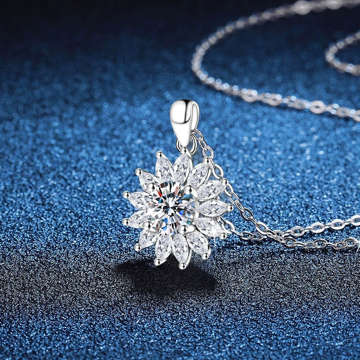 Starburst Moissanite Pendant Necklace in Platinum-Plated S925 Sterling Silver blue background angled view
