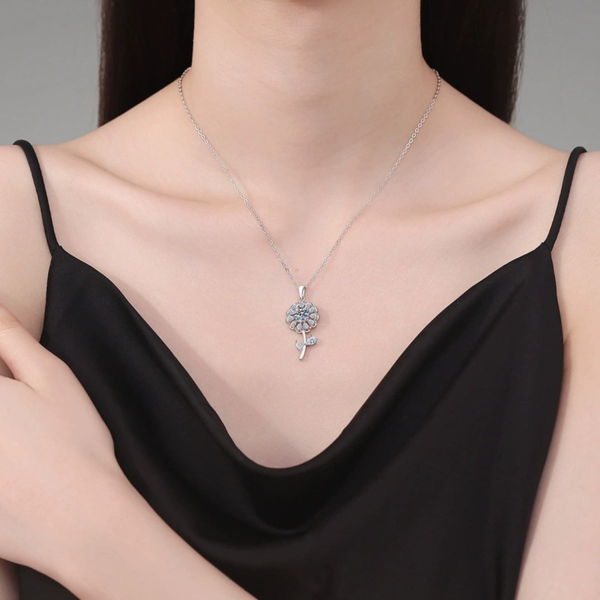 Floral Stem Moissanite Pendant Necklace in Platinum-Plated S925 Sterling Silver worn on neckline by model
