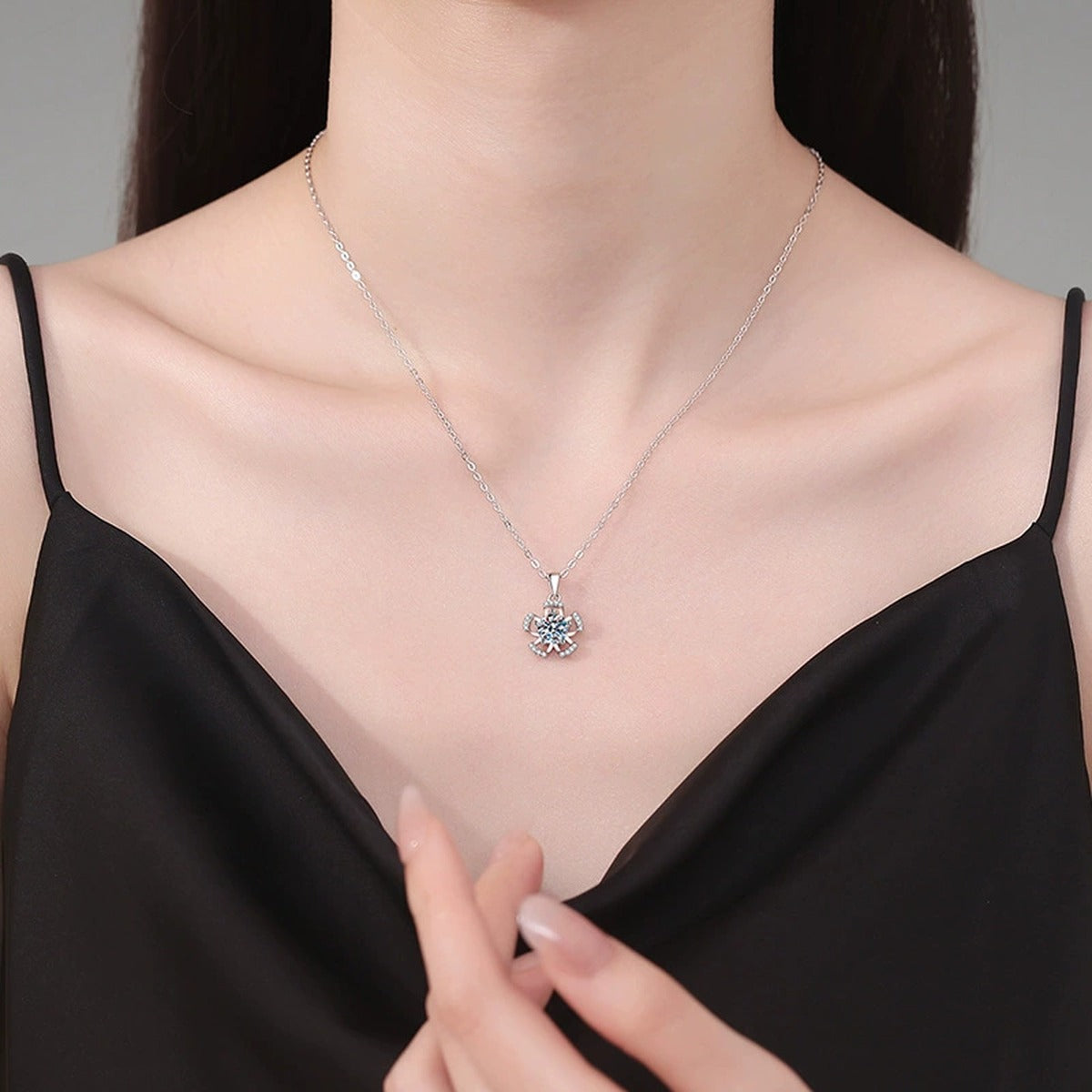 Bow Flower Moissanite Pendant Necklace in Platinum-Plated S925 Sterling Silver worn on neckline by model