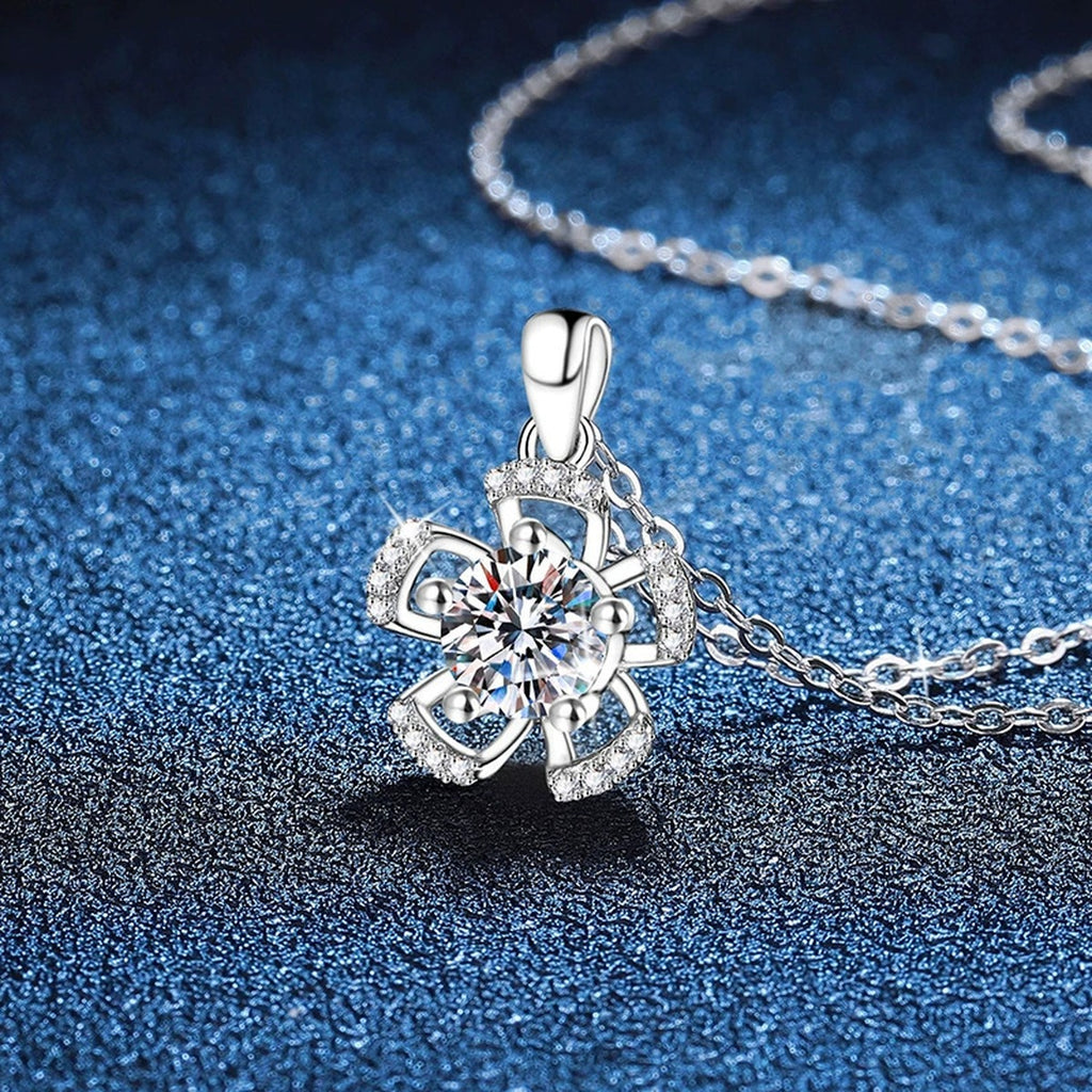Bow Flower Moissanite Pendant Necklace in Platinum-Plated S925 Sterling Silver blue background angled view