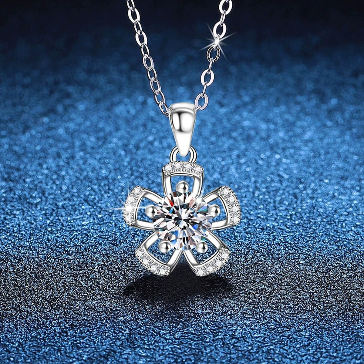 Bow Flower Moissanite Pendant Necklace in Platinum-Plated S925 Sterling Silver blue background close-up view