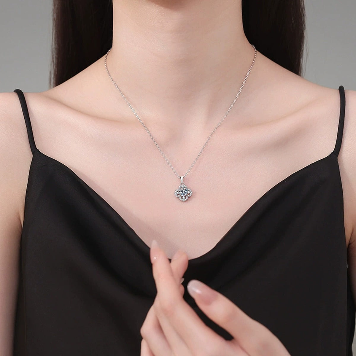 Clover Halo Moissanite Pendant Necklace in Platinum-Plated S925 Sterling Silver worn on neckline by model