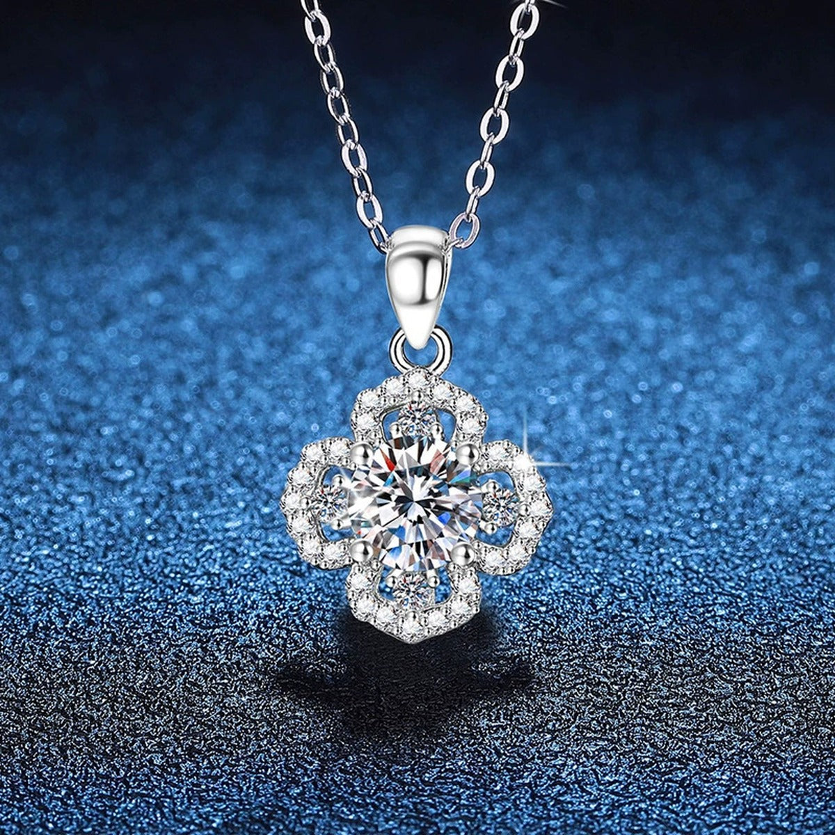 Clover Halo Moissanite Pendant Necklace in Platinum-Plated S925 Sterling Silver blue background close-up view