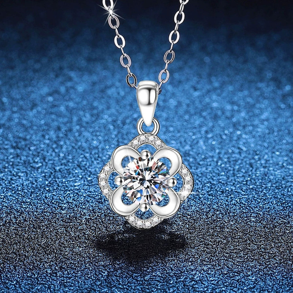 Camellia Flower Moissanite Pendant Necklace in Platinum-Plated S925 Sterling Silver blue background close-up view