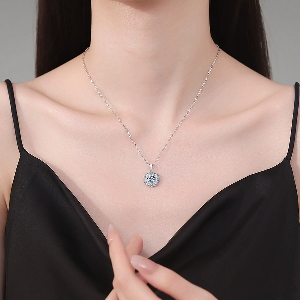 Sunburst Halo Moissanite Pendant Necklace in Platinum-Plated S925 Sterling Silver worn on neckline by model