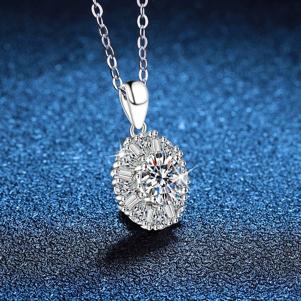 Sunburst Halo Moissanite Pendant Necklace in Platinum-Plated S925 Sterling Silver blue background angled view