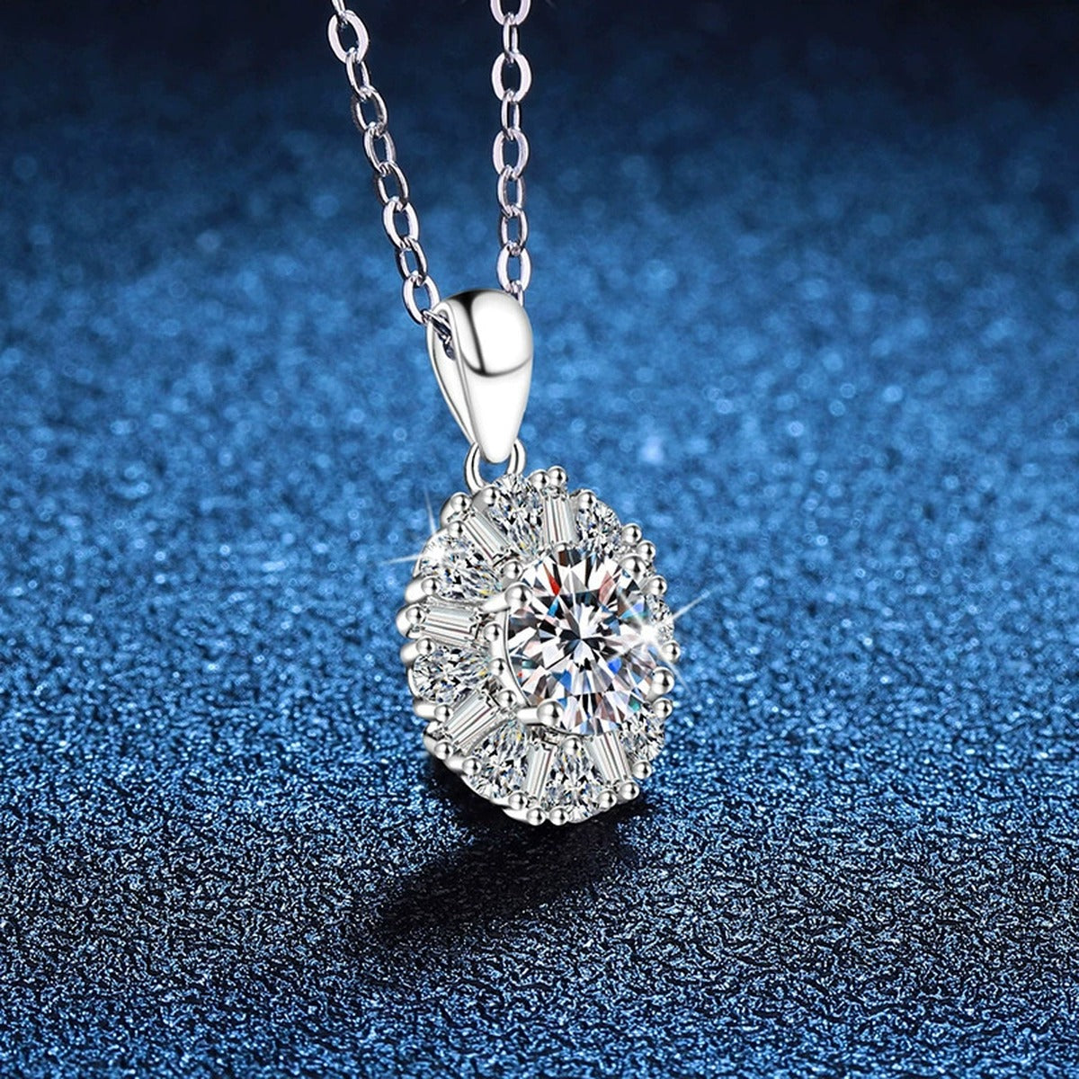Sunburst Halo Moissanite Pendant Necklace in Platinum-Plated S925 Sterling Silver blue background angled view