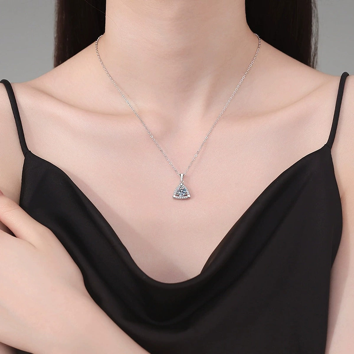 Trillion Halo Moissanite Pendant Necklace in Platinum-Plated S925 Sterling Silver worn on neckline by model