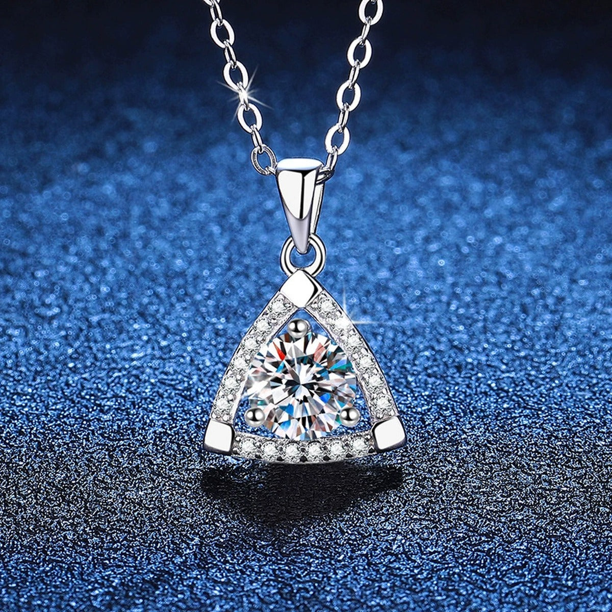 Trillion Halo Moissanite Pendant Necklace in Platinum-Plated S925 Sterling Silver blue background angled view