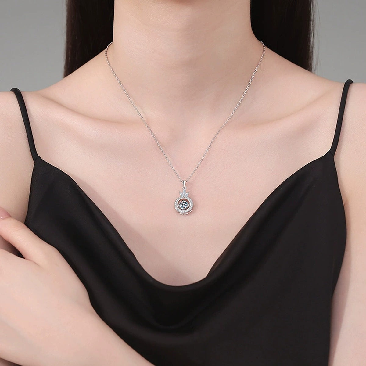 Crown Round Halo Moissanite Pendant Necklace in Platinum-Plated S925 Sterling Silver worn on neckline by model