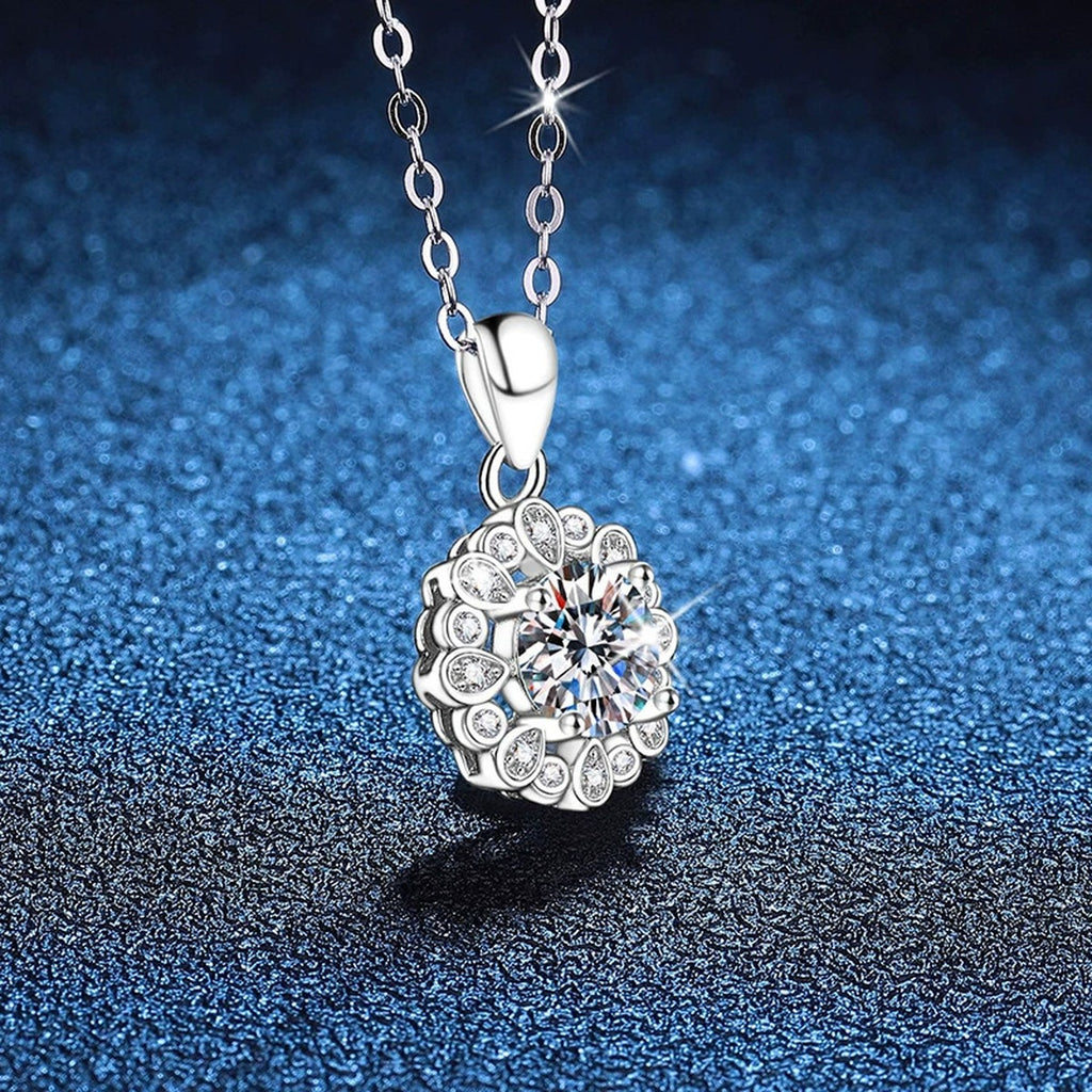 Round Cluster Halo Moissanite Pendant Necklace in Platinum-Plated S925 Sterling Silver blue background angled view