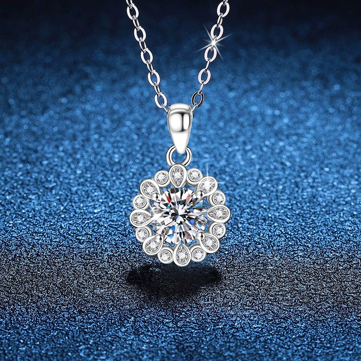 Round Cluster Halo Moissanite Pendant Necklace in Platinum-Plated S925 Sterling Silver blue background close-up view