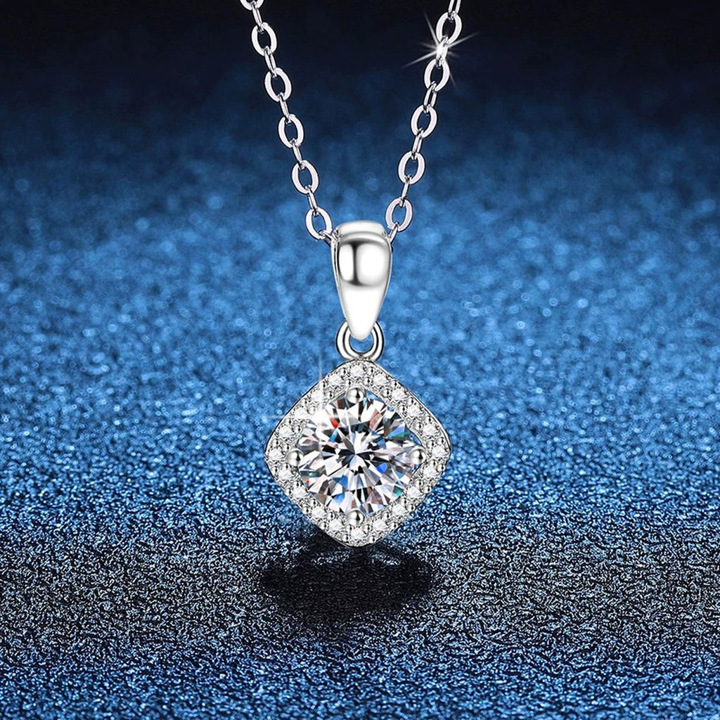 Kite Halo Moissanite Pendant Necklace in Platinum-Plated S925 Sterling Silver blue background angled view