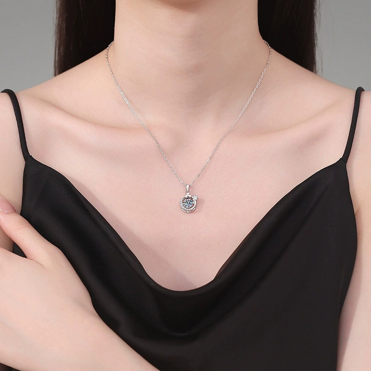 Floral Crescent Moissanite Pendant Necklace in Platinum-Plated S925 Sterling Silver worn on neckline by model