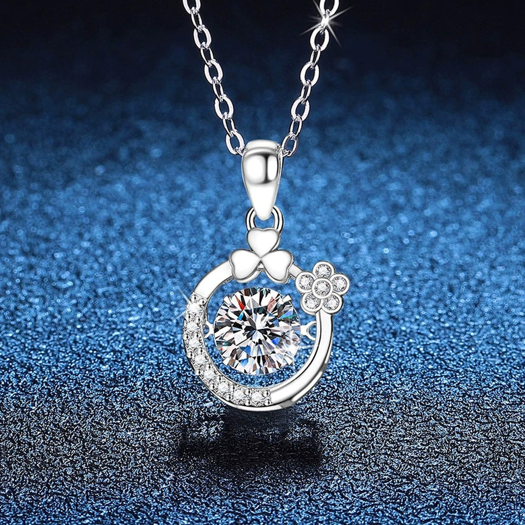 Floral Crescent Moissanite Pendant Necklace in Platinum-Plated S925 Sterling Silver blue background angled view