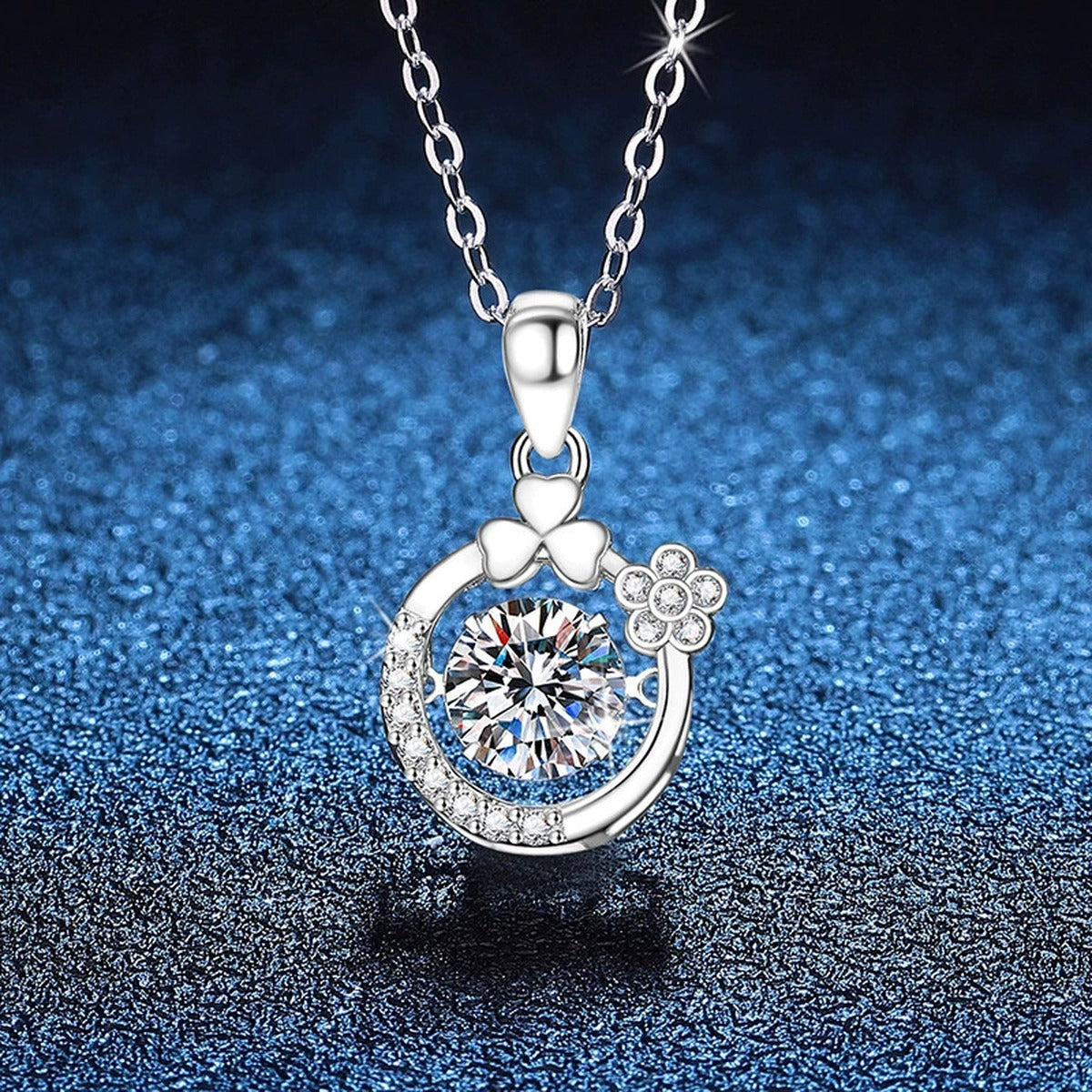 Floral Crescent Moissanite Pendant Necklace in Platinum-Plated S925 Sterling Silver blue background angled view