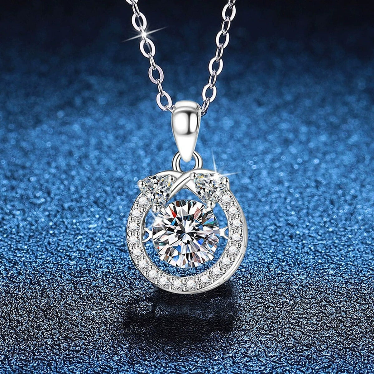 Oval Halo Moissanite Pendant Necklace in Platinum-Plated S925 Sterling Silver blue background angled view