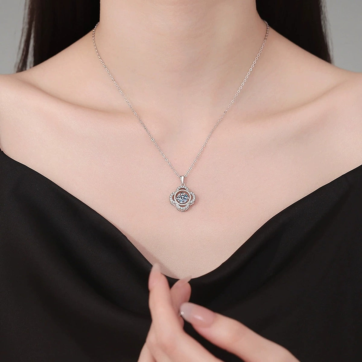 Quatrefoil Halo Moissanite Pendant Necklace in Platinum-Plated S925 Sterling Silver worn on neckline by model