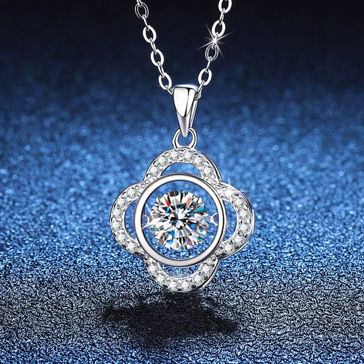 Quatrefoil Halo Moissanite Pendant Necklace in Platinum-Plated S925 Sterling Silver blue background close-up view