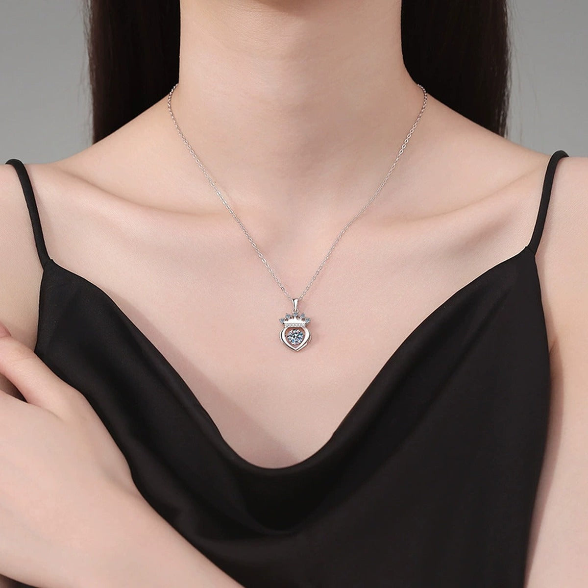 Crown Heart Moissanite Pendant Necklace in Platinum-Plated S925 Sterling Silver worn on neckline by model