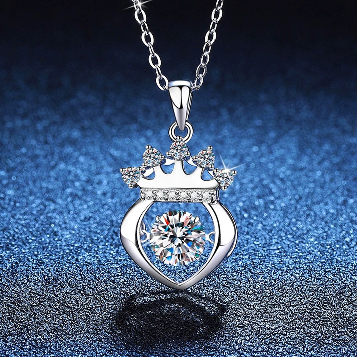 Crown Heart Moissanite Pendant Necklace in Platinum-Plated S925 Sterling Silver blue background close-up view
