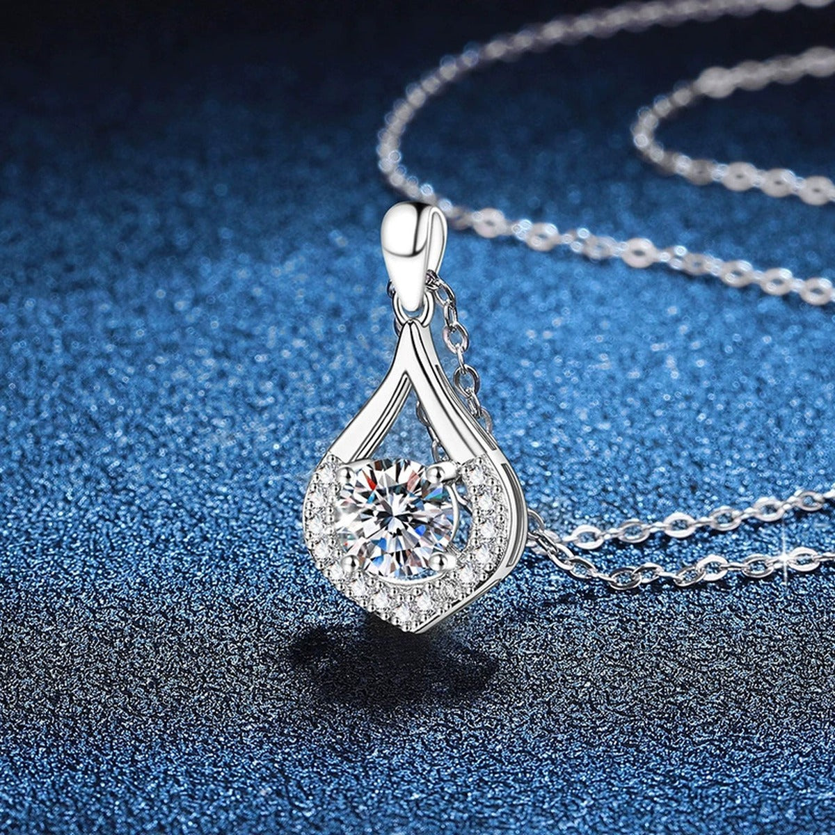 Teardrop Halo Moissanite Pendant Necklace in Platinum-Plated S925 Sterling Silver blue background product view