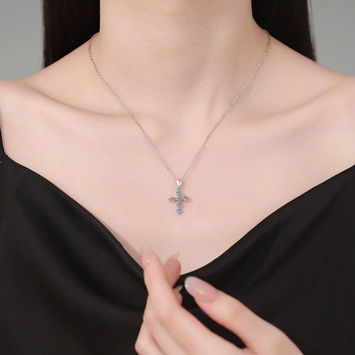 Multi-Stone Cross Moissanite Pendant Necklace in Platinum-Plated S925 Sterling Silver worn on neckline by model