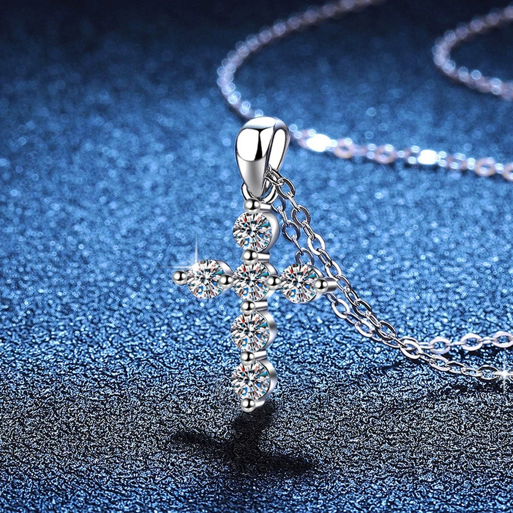 Multi-Stone Cross Moissanite Pendant Necklace in Platinum-Plated S925 Sterling Silver blue background angled view