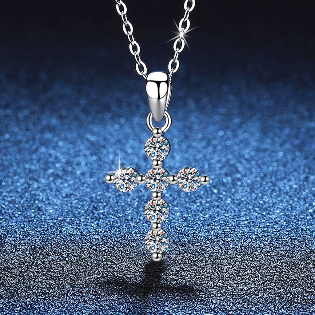 Multi-Stone Cross Moissanite Pendant Necklace in Platinum-Plated S925 Sterling Silver blue background close-up view