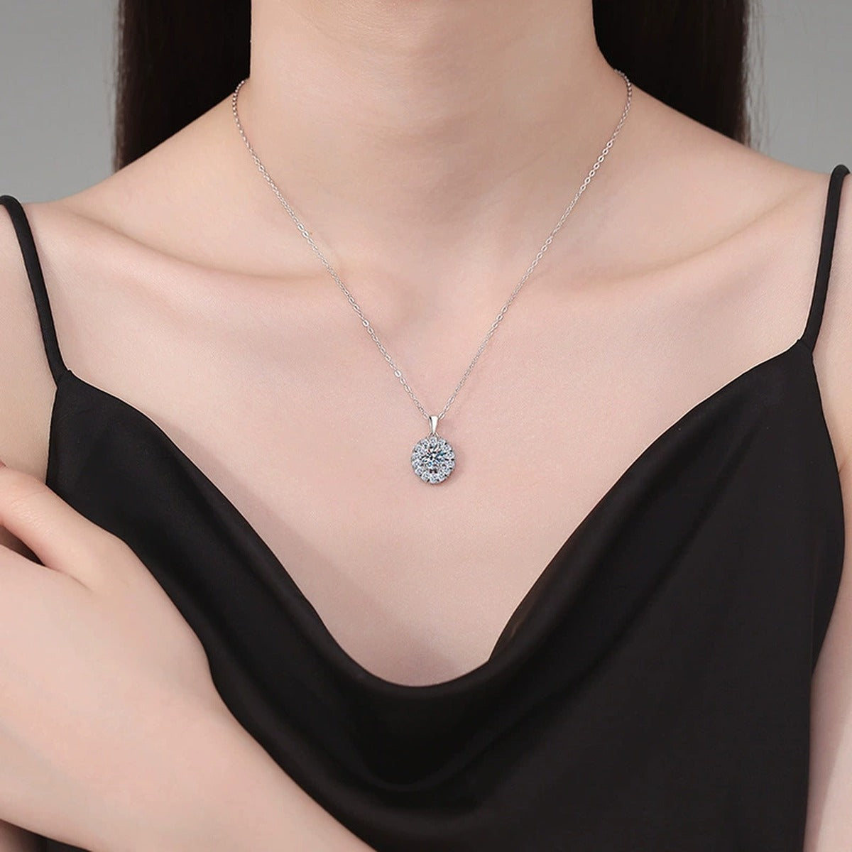 Sunburst Halo Moissanite Pendant Necklace in Platinum-Plated S925 Sterling Silver worn on neckline by model