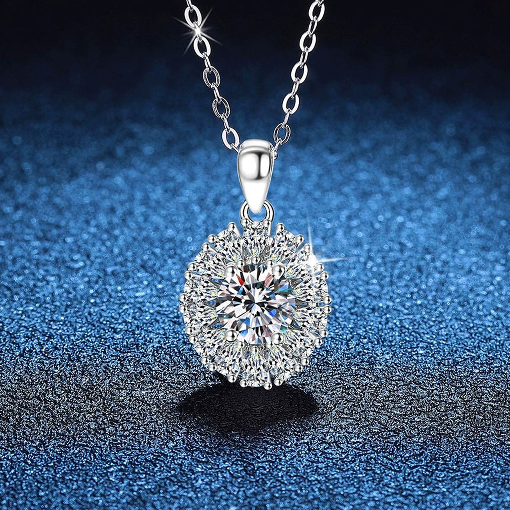 Sunburst Halo Moissanite Pendant Necklace in Platinum-Plated S925 Sterling Silver blue background angled view