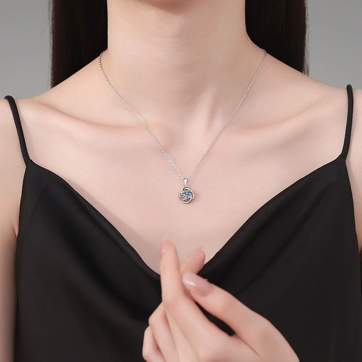 Round Loop Moissanite Pendant Necklace in Platinum-Plated S925 Sterling Silver worn on neckline by model