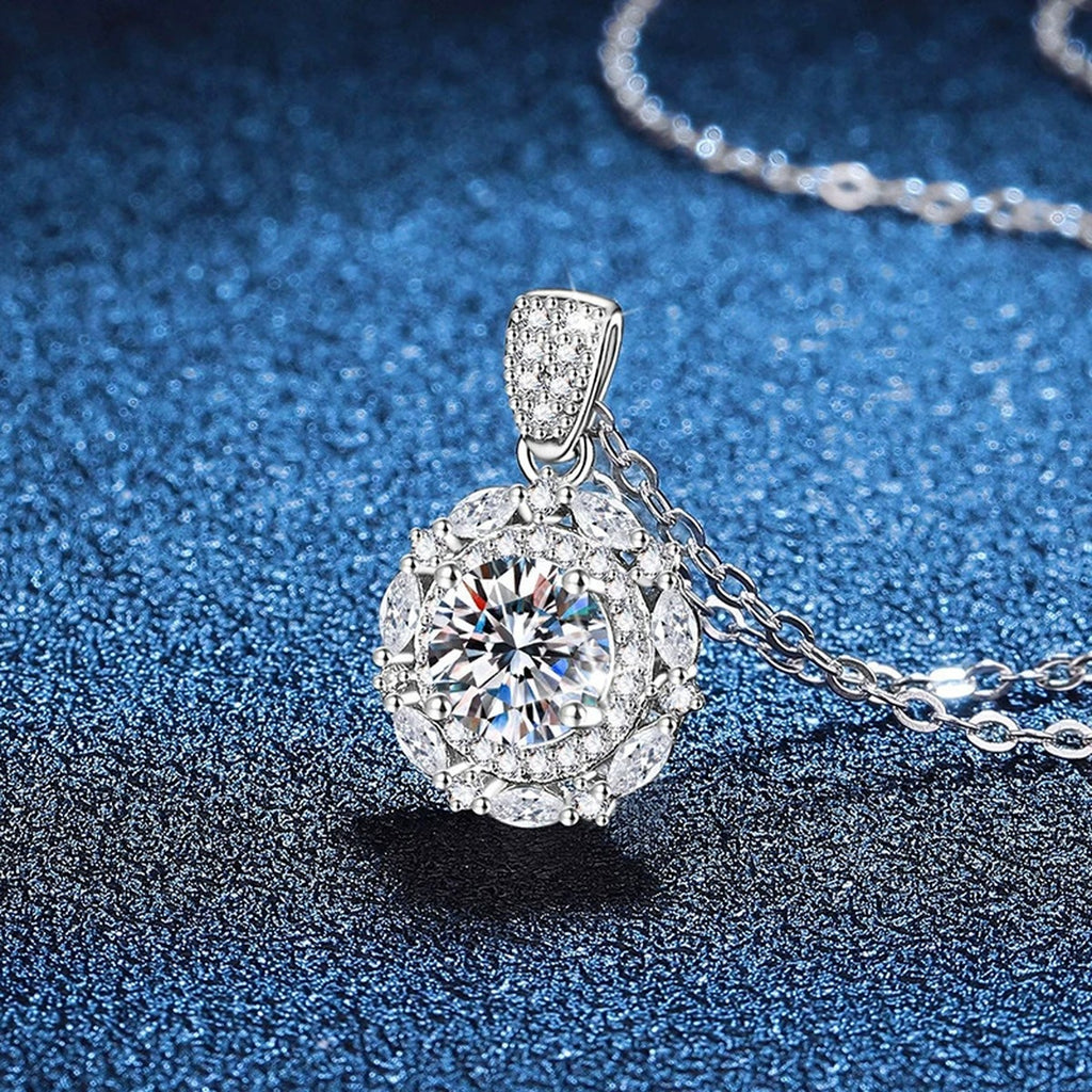 Round Halo Moissanite Pendant Necklace in Platinum-Plated S925 Sterling Silver blue background angled view