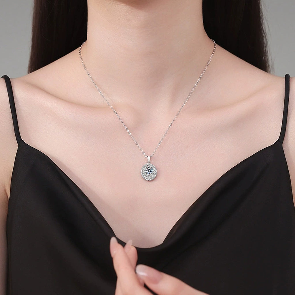 Round Baguette Halo Moissanite Pendant Necklace in Platinum-Plated S925 Sterling Silver worn on neckline by model