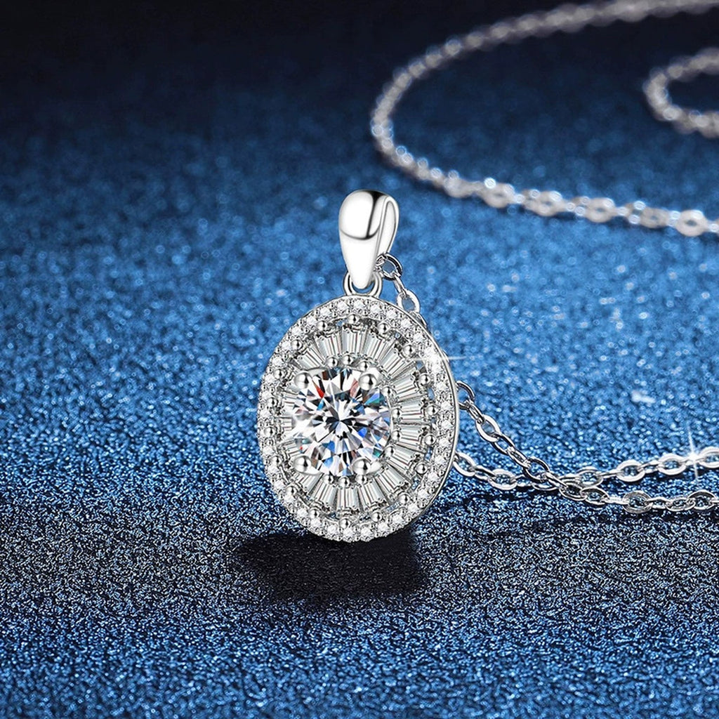 Round Baguette Halo Moissanite Pendant Necklace in Platinum-Plated S925 Sterling Silver blue background angled view