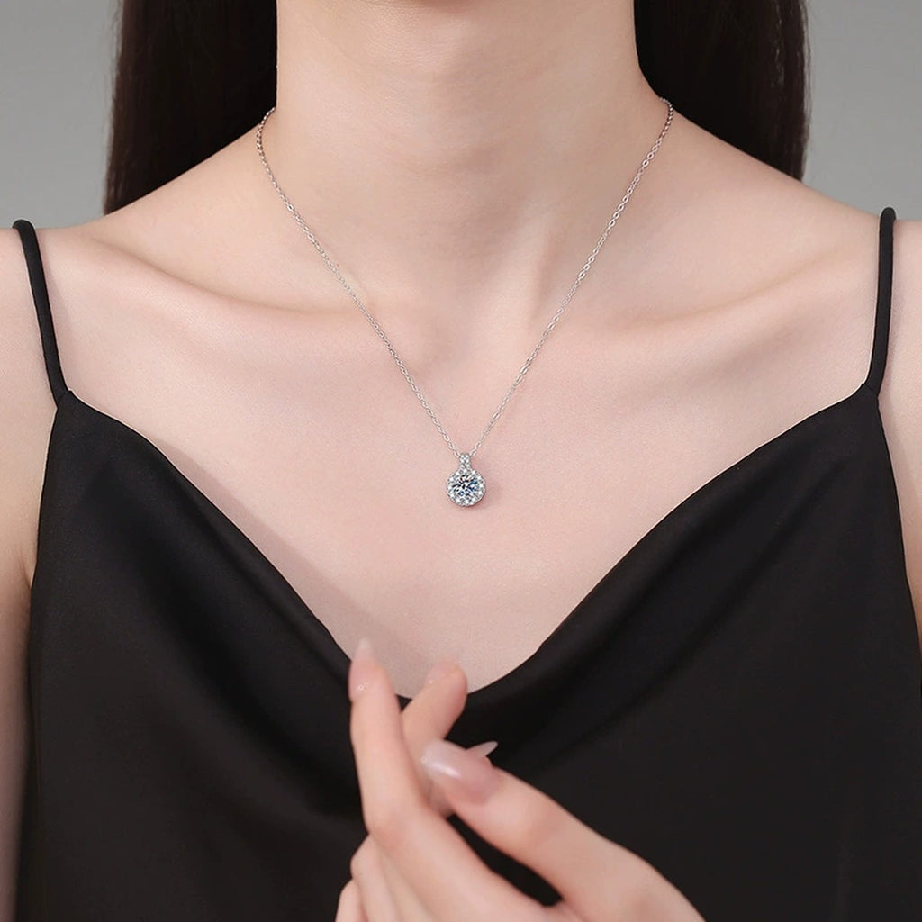Round Halo Moissanite Pendant Necklace in Platinum-Plated S925 Sterling Silver worn on neckline by model