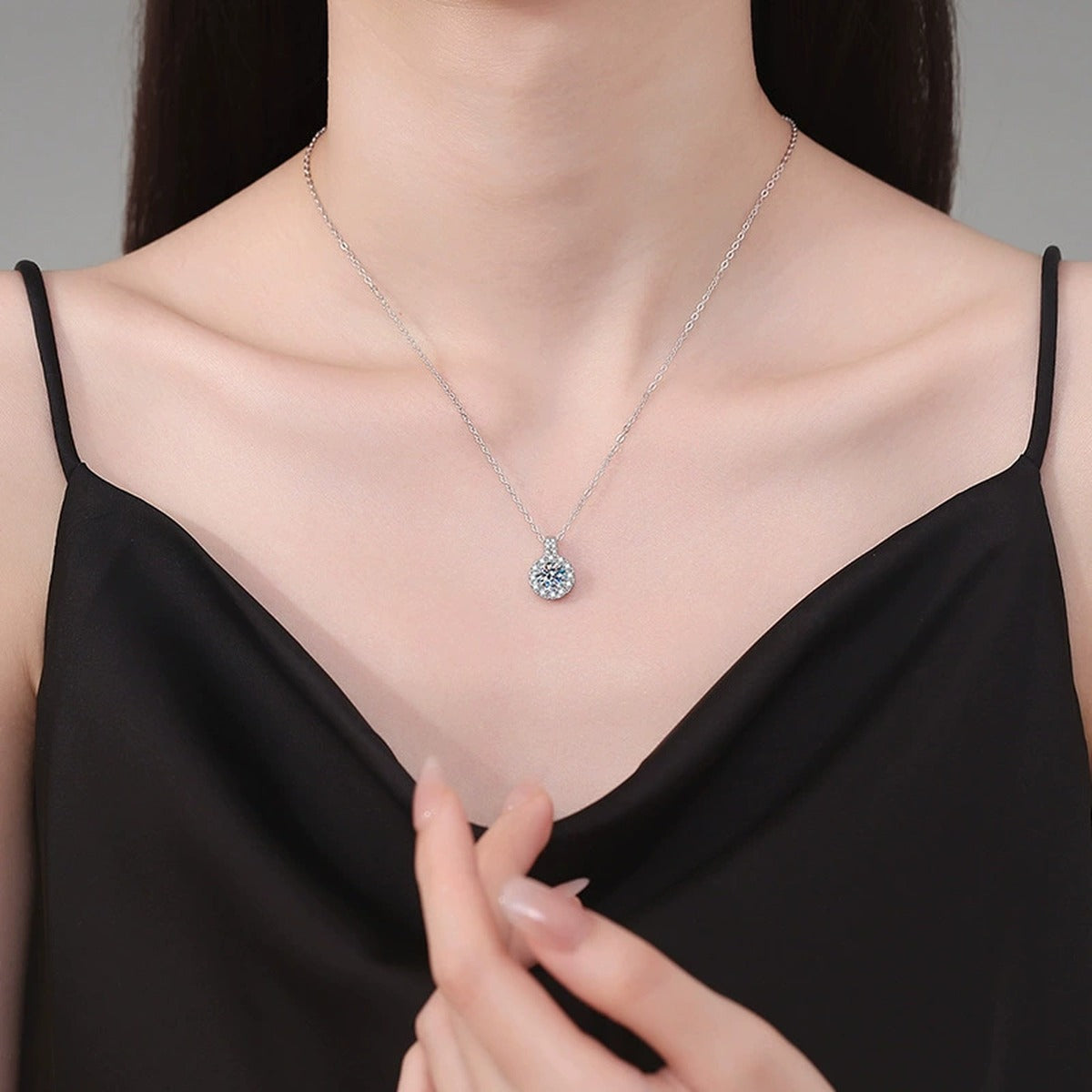 Round Halo Moissanite Pendant Necklace in Platinum-Plated S925 Sterling Silver worn on neckline by model