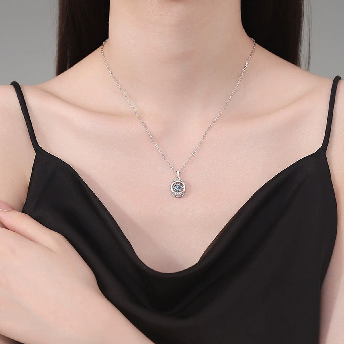 Round Orbital Halo Moissanite Pendant Necklace in Platinum-Plated S925 Sterling Silver worn on neckline by model
