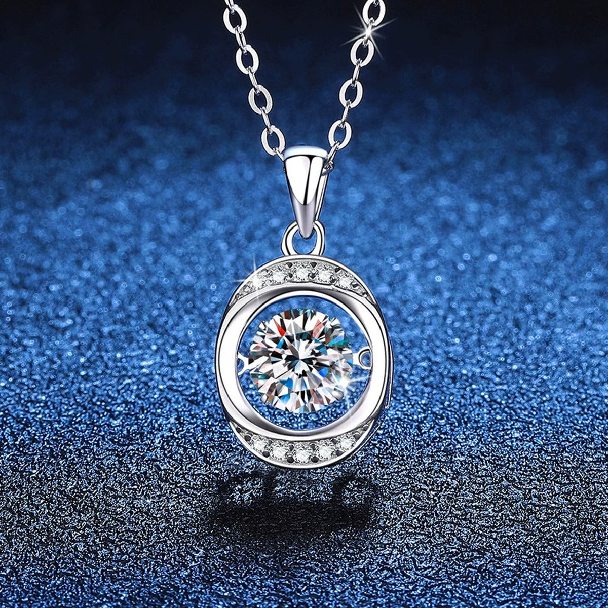 Round Orbital Halo Moissanite Pendant Necklace in Platinum-Plated S925 Sterling Silver blue background angled view